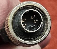 A close up of S-video plug with locking ring